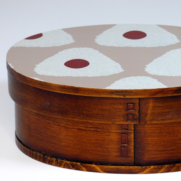 Dark wood bento box with painted lid