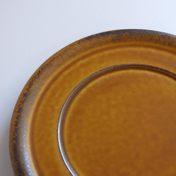 Close up of caramel coloured saucer