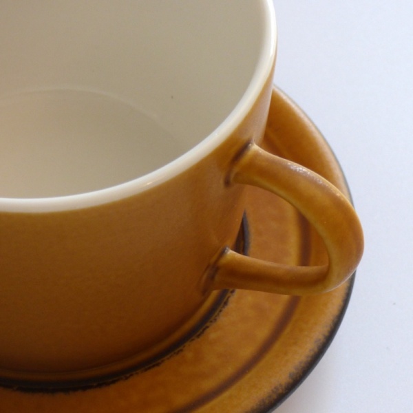 Close up of caramel coloured cup and saucer