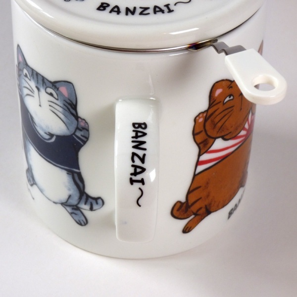 'Banzai' cat design mug handle detail