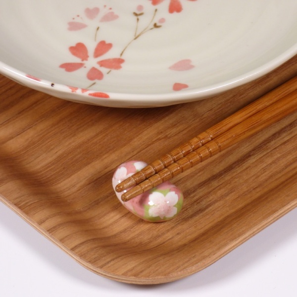 Hashi chopsticks on small blossom pattern chopstick rest