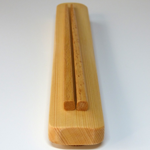 Wooden chopsticks on top of wooden box