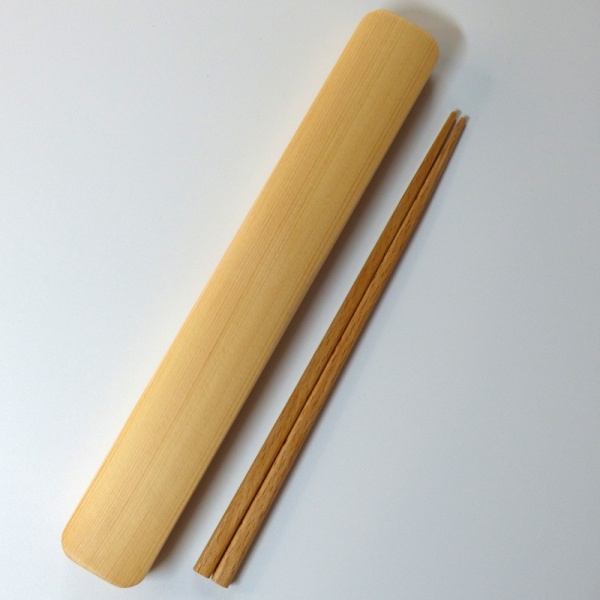 Wooden Japanese chopsticks next to closed wooden box