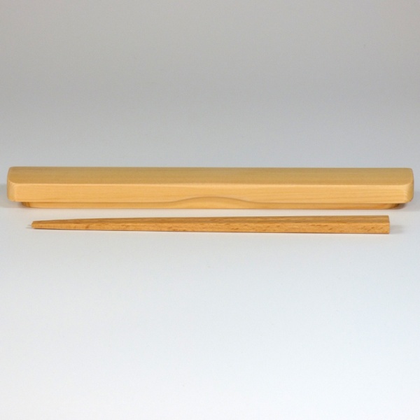 Wooden Japanese chopsticks next to closed wooden box