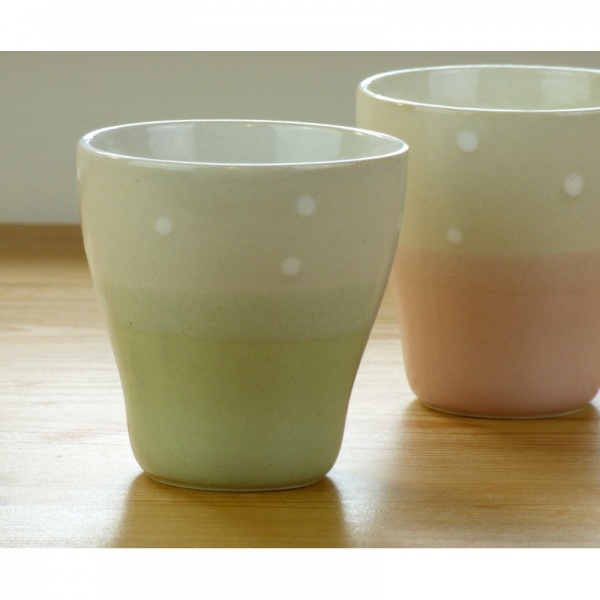 Pair of traditional Japanese teacups, green and pink