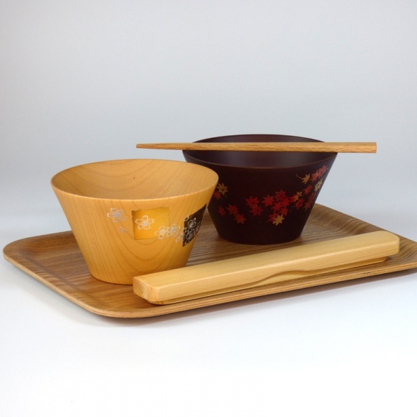 Japanese wooden bowls on a tray with chopsticks