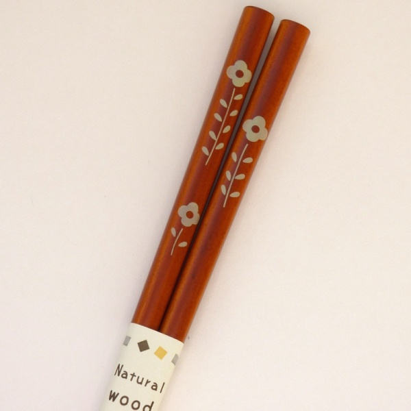 Mid tone natural wood Japanese chopsticks with flower design