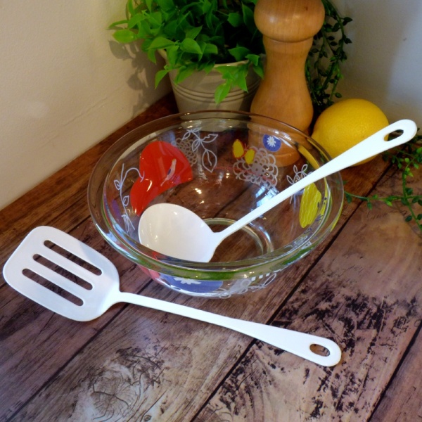 White enamel mini ladle in kitchen setting