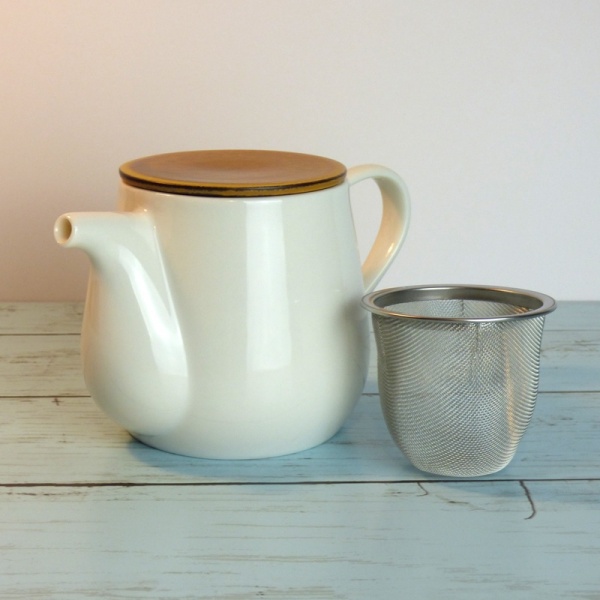 White ceramic Japanese teapot with removable strainer