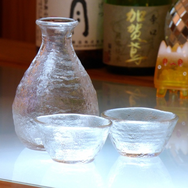 Mount Fuji glass sake jug on bar with two sake glasses