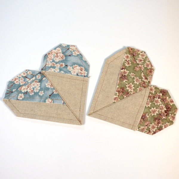 Two fabric heart shaped coasters