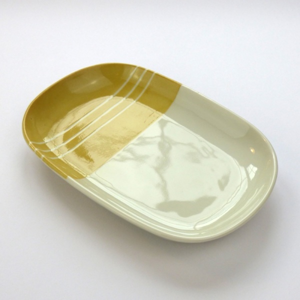 Oval Japanese ceramic plate with yellow dipped glaze design
