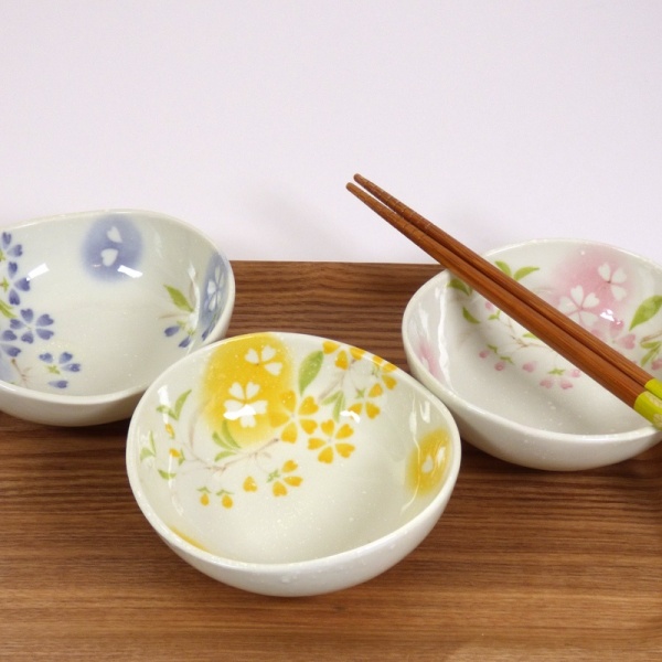 Three 'Petal' bowls in pink, blue and yellow