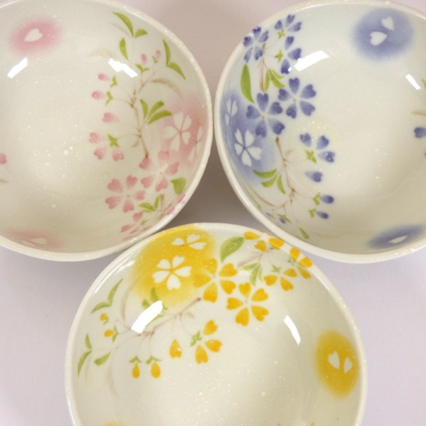 Three 'Petal' bowls in pink, blue and yellow