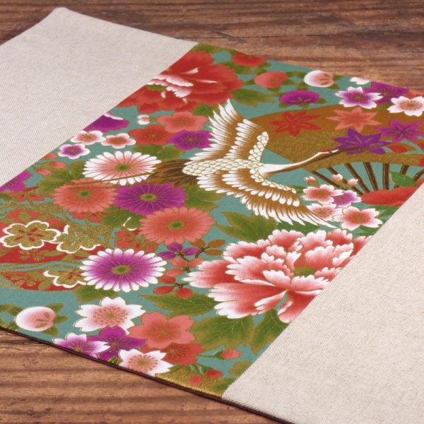 Close up of cranes design Japanese fabric placemat