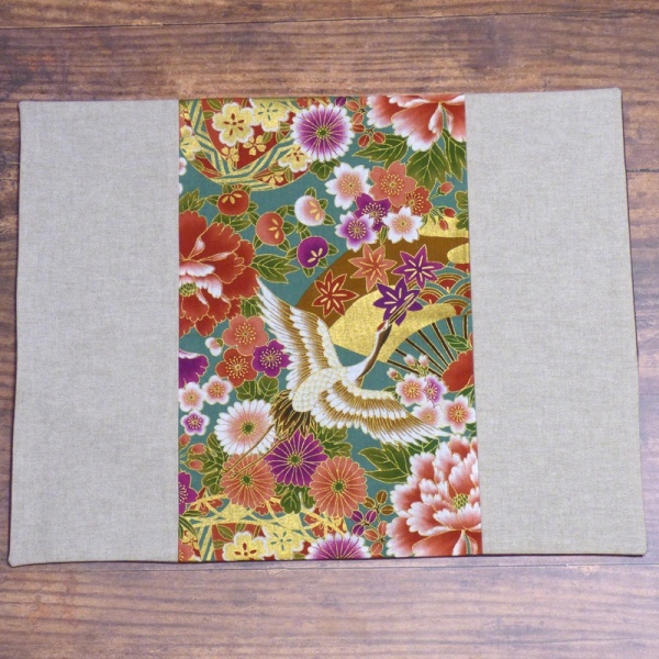 Japanese fabric placemat with vibrant cranes design