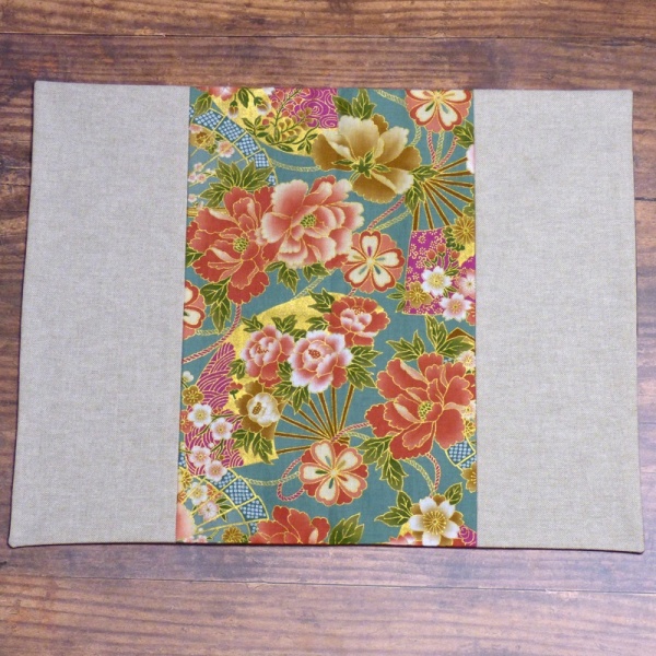 Japanese fabric placemat with vibrant flowers and fans design