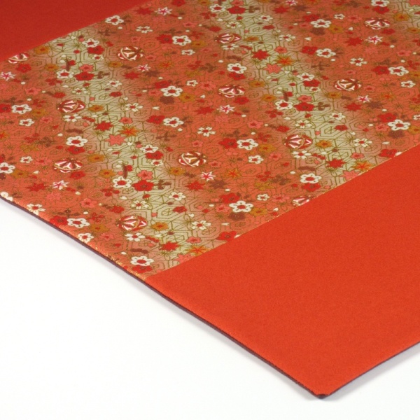 Close up of Flowers & Bells orange fabric placemat