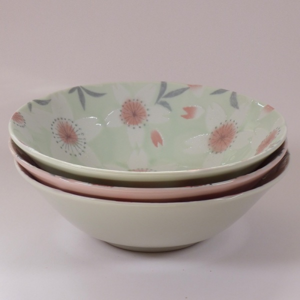 Stack of three 'Sakura Temari' bowls in cream, pink and green