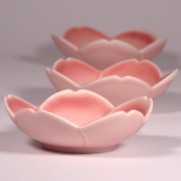 Three flower shaped bowls