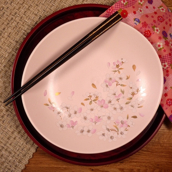 Pale pink sakura design Japanese plate in a table setting