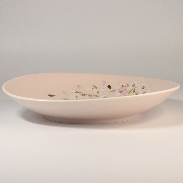 Profile view of pink sakura design serving plate