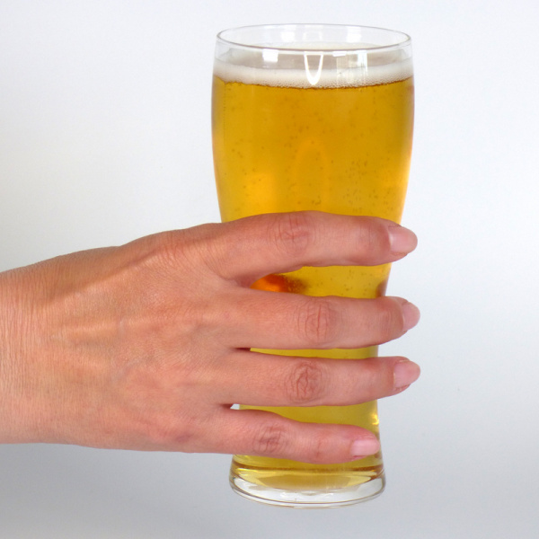 Slim Japanese beer glass held in hand