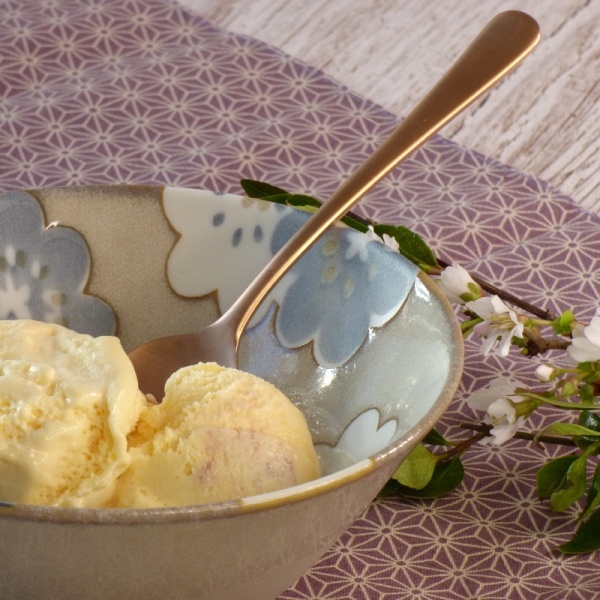 Rose gold sundae and ice cream spoon in bowl of ice cream