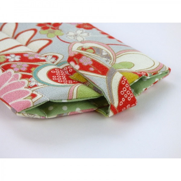 Sunglasses case in pale grey traditional Japanese floral fabric close up of closed fastening
