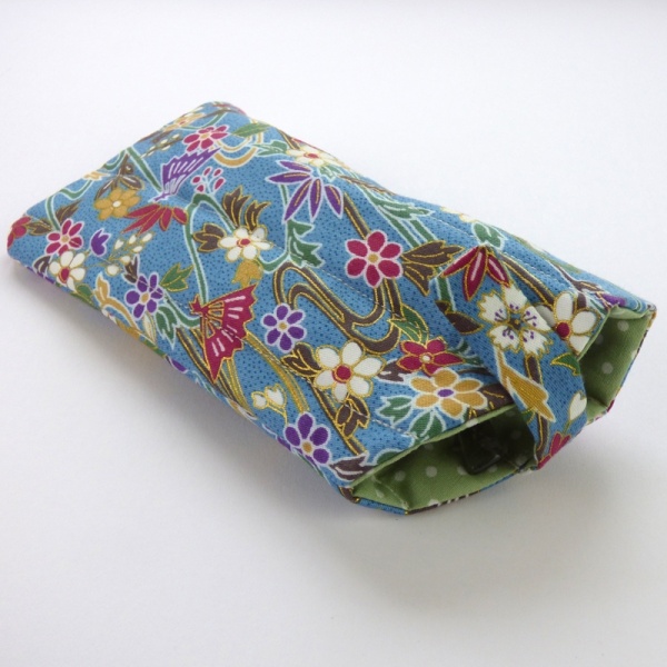 Sunglasses case in light blue traditional Japanese fans and water pattern fabric with sunglasses inserted and closed fastening