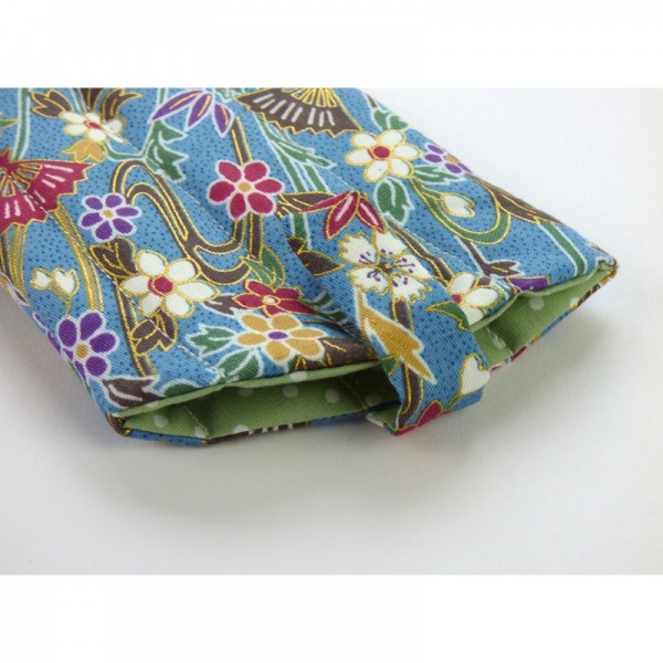 Sunglasses case in light blue traditional Japanese fans and water pattern fabric close up of fastening