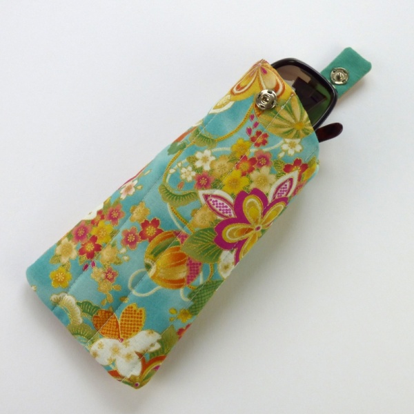 Sunglasses case in turquoise blue traditional Japanese fabric with sunglasses inserted