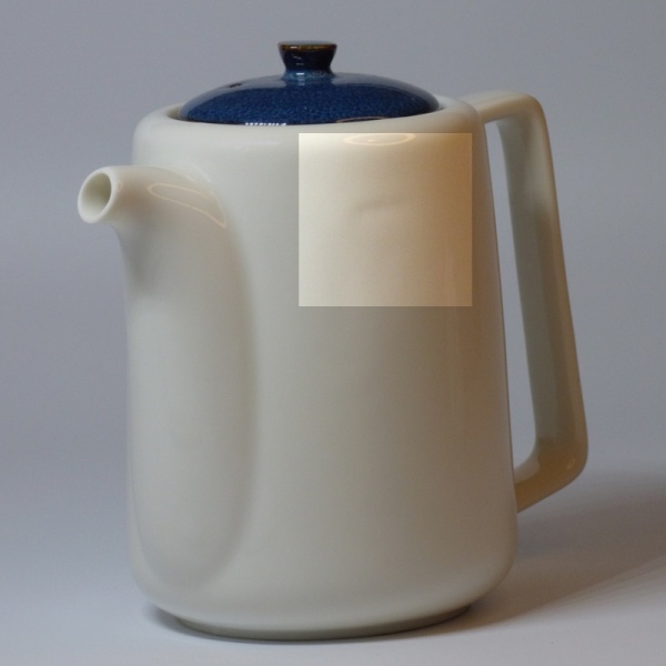 Highlighting the small indentation on the side of Japanese teapot