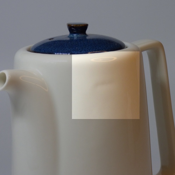 Highlighting the small indentation on the side of Japanese teapot