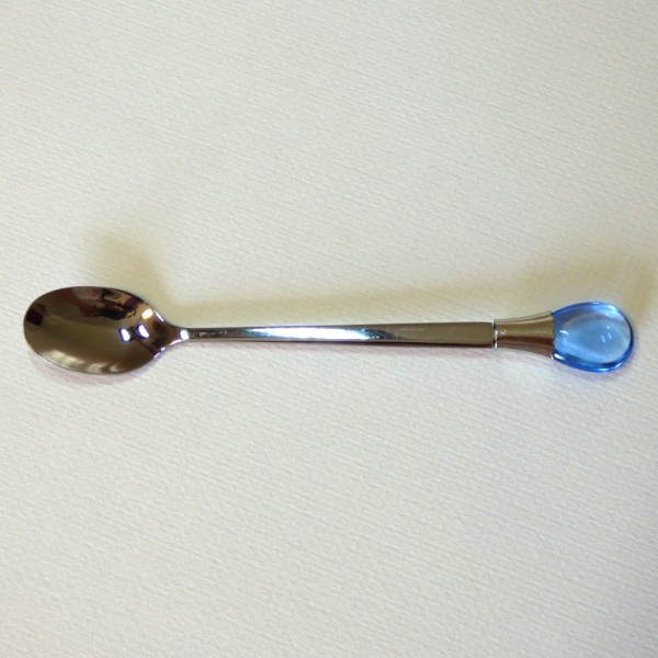 Teaspoon with blue coloured gem ornament