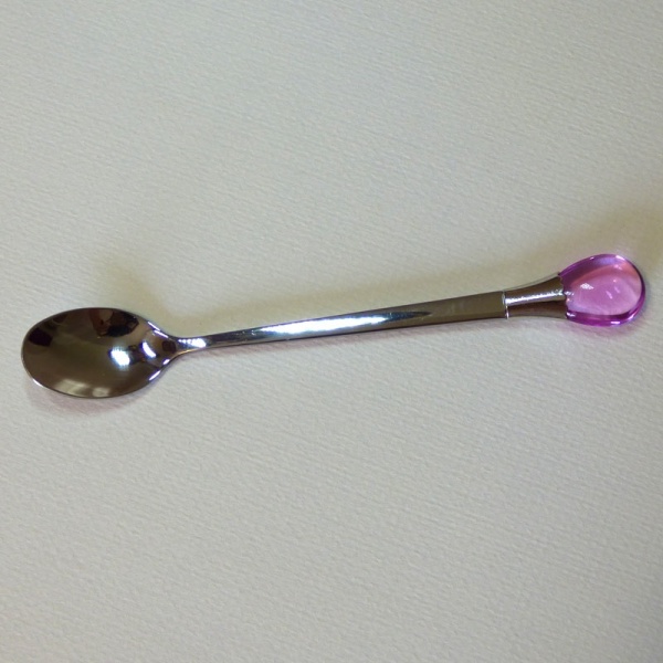 Teaspoon with pink coloured gem ornament