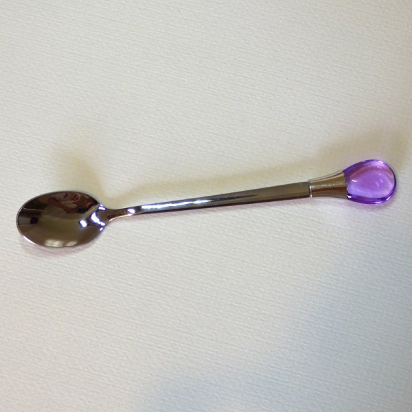 Teaspoon with purple coloured gem ornament