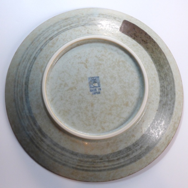 Underside of plum blossom plate showing 'Enso' circle design
