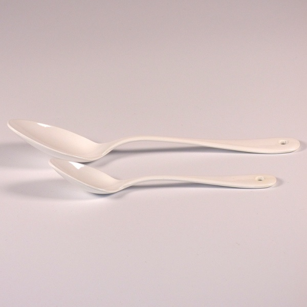 White enamel dessert spoon and teaspoon