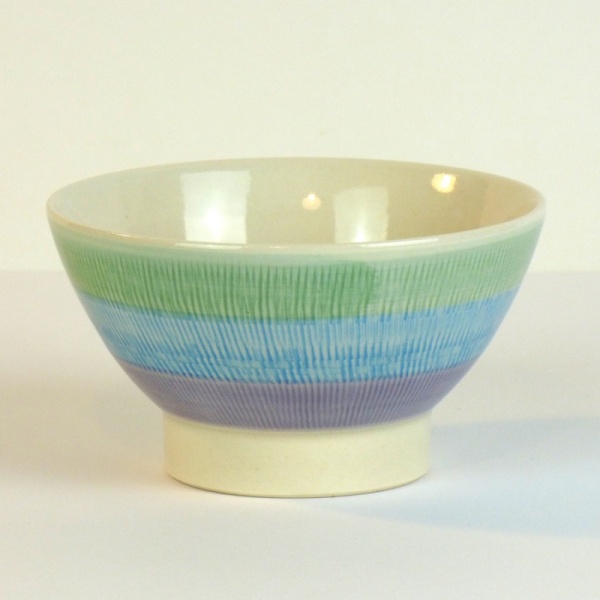 Japanese ceramic bowl with green, blue and purple striped pattern
