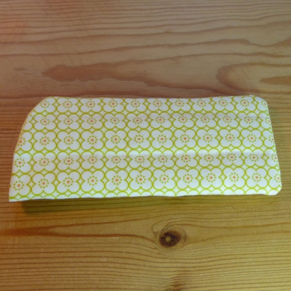 Handmade quilted glasses case in a yellow geometric print