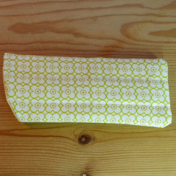 Handmade quilted glasses case in a yellow geometric print