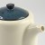 Close up of blue lid and spout of Japanese teapot