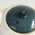 Close up detail of mottled blue teapot lid