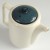 Top down view of white Japanese teapot showing mottled blue lid