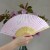 Pink 'Sakura' cherry blossom paper fan held in hand