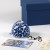 Blue and white 'Arabesque' design furin wind chime on table surface