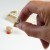 Calendar kanji character stamp held in thumb and forefinger