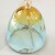 Close up of top golden moon design on glass wind chime