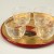 Sake glasses on Japanese gold and red tray